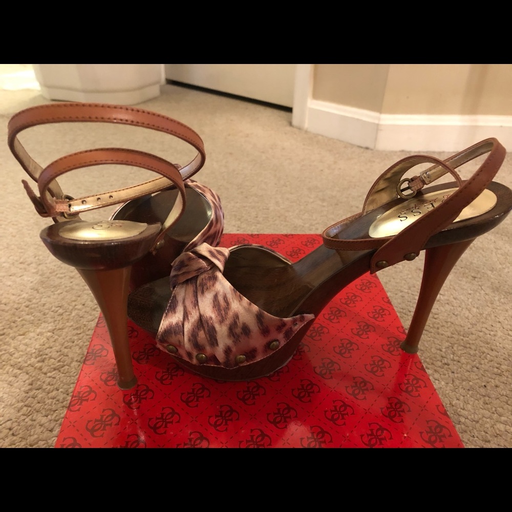 Gently used Guess sandals. Small scratch on heel.
